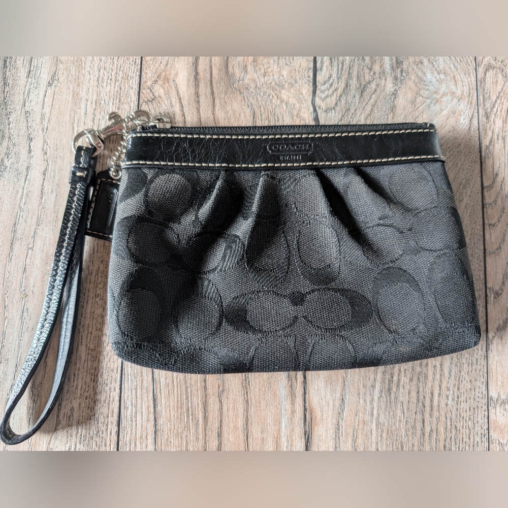 COACH Wristlet Black Monogram with Red Interior in Excellent Used Condition